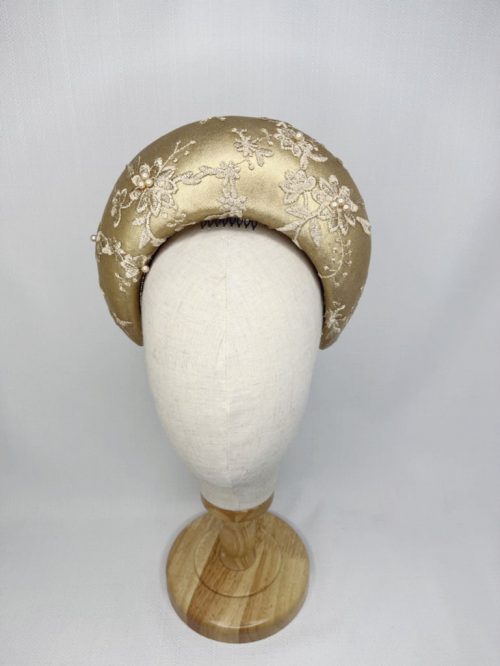 Gold leather halo heapiece covered with beaded mesh lace.