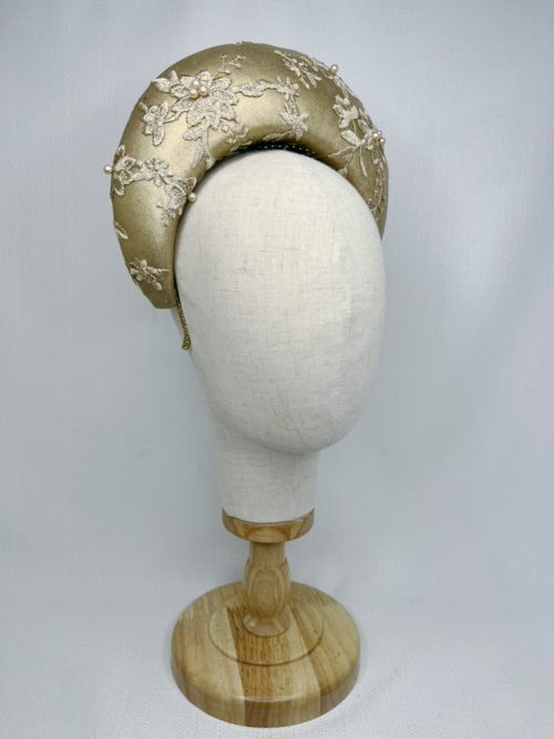 Gold leather halo headpiece covered with beaded mesh lace.